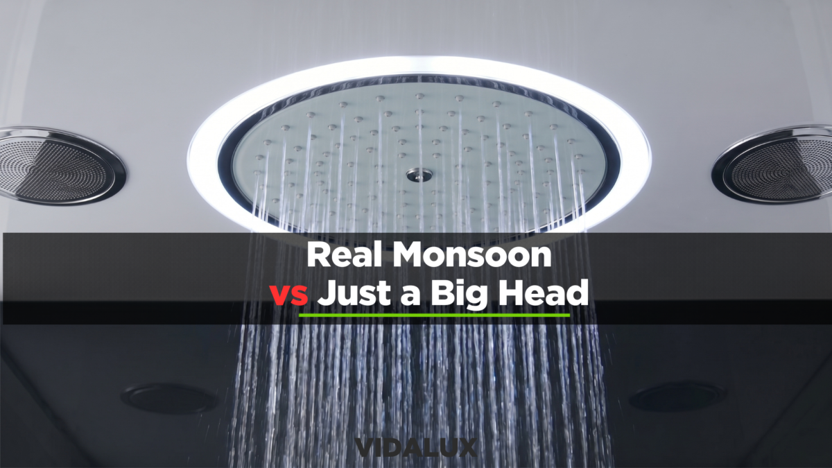 Square chrome ceiling-mounted monsoon shower head delivering an even sheet of falling water in a calm, daylit bathroom interior.