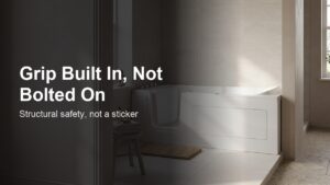 Vidalux Abberton 1700 walk-in bath installed in a naturally-lit British bathroom, with overlay text reading "Grip Built In, Not Bolted On — structural safety, not a sticker.