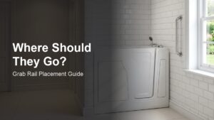 A bright, modern accessible bathroom with a Vidalux walk-in bath and chrome grab rail mounted on the white tiled wall, door open showing low step-in threshold.