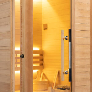 Freshly cleaned pale cedar interior of the Vidalux Klassikko sauna with bucket and ladle