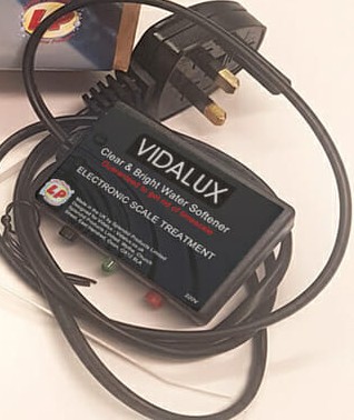 The Vidalux Clear & Bright Water Softener, a small electronic scale treatment unit with its mains lead and aerial