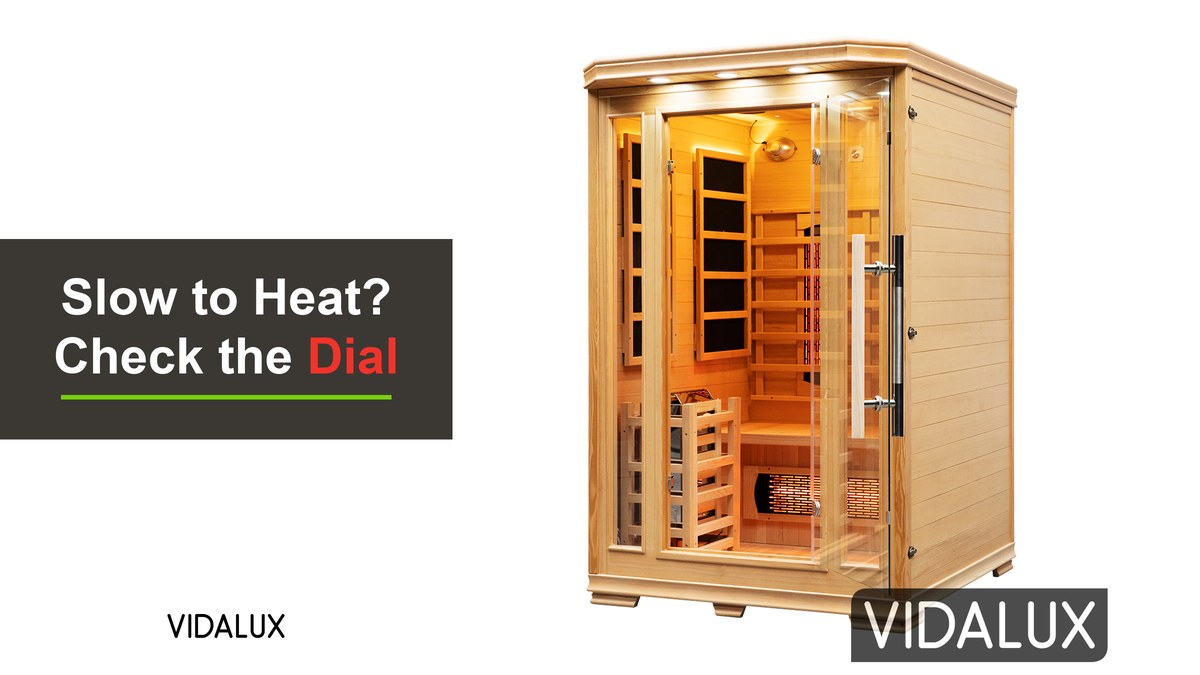 The Vidalux 2 Person Hybrid Sauna in Canadian hemlock, seen from the front with its glass door, infrared wall panels, backrest heaters and guarded traditional stove inside, shown against white.