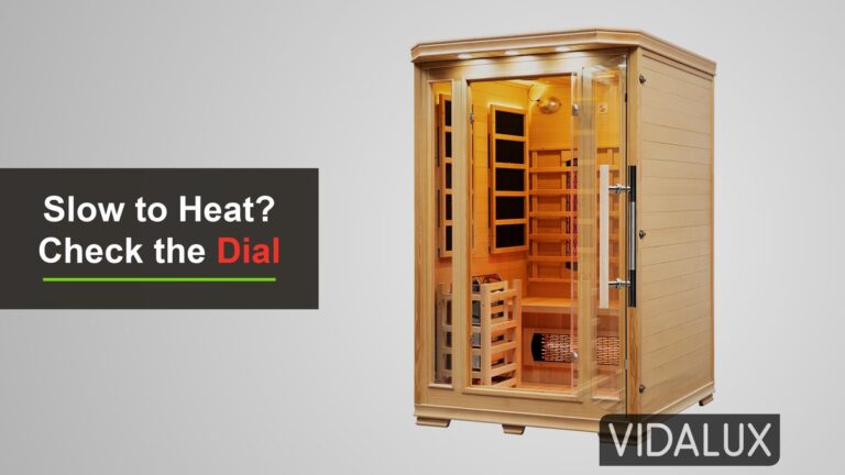 The Vidalux 2 Person Hybrid Sauna in Canadian hemlock, seen from the front with its glass door, infrared wall panels, backrest heaters and guarded traditional stove inside on a grey background.