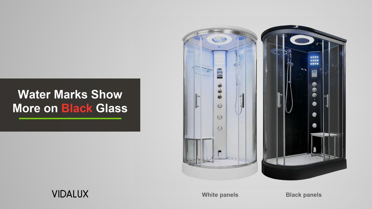 Two Vidalux steam shower cabins side by side, the Essence 1000 with white back panels and the Clearwater 1200 with black back panels, both with clear glass doors on a grey background.